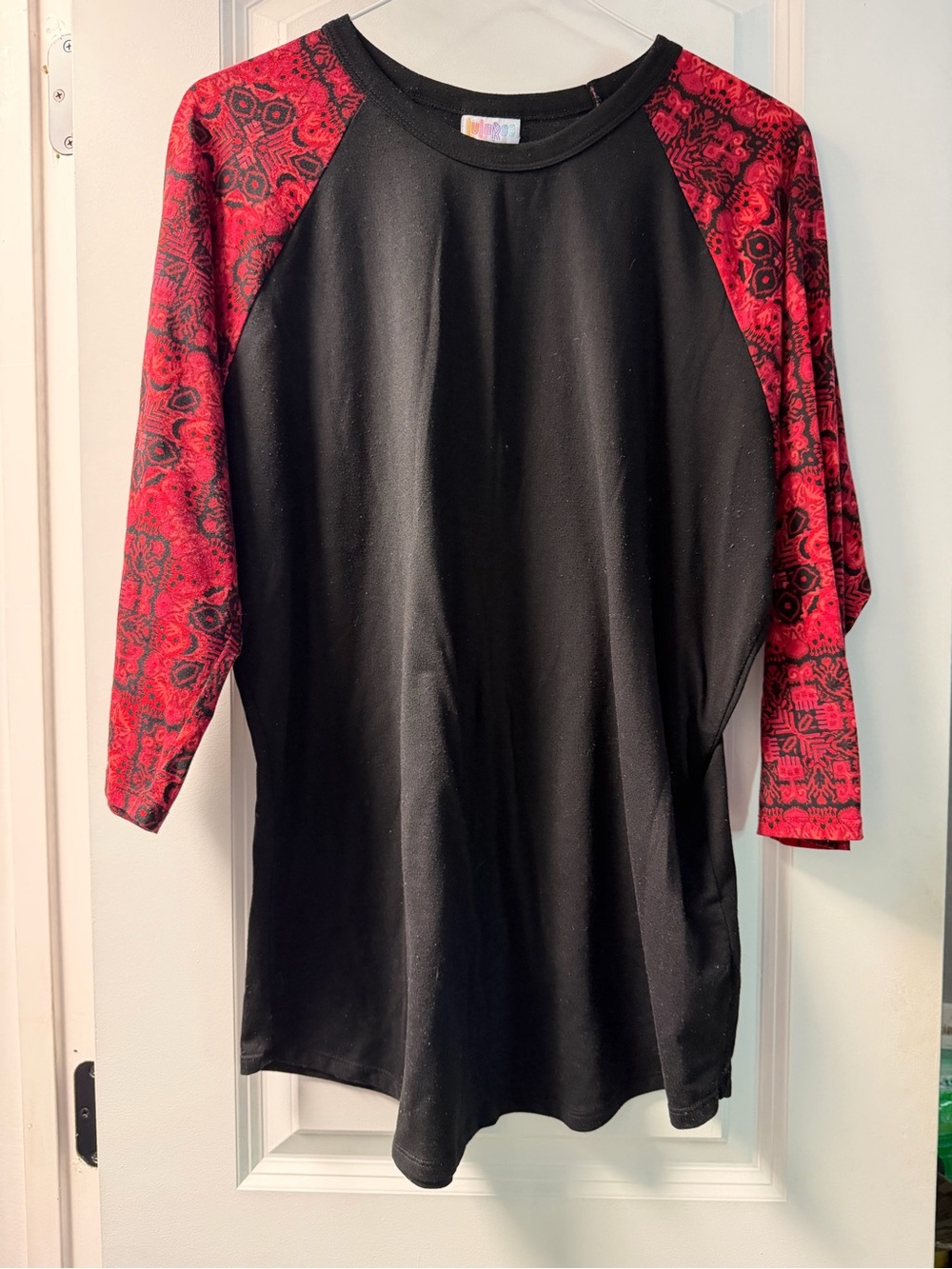 LuLaRoe Black Tunic with Red Patterned Raglan Sleeves